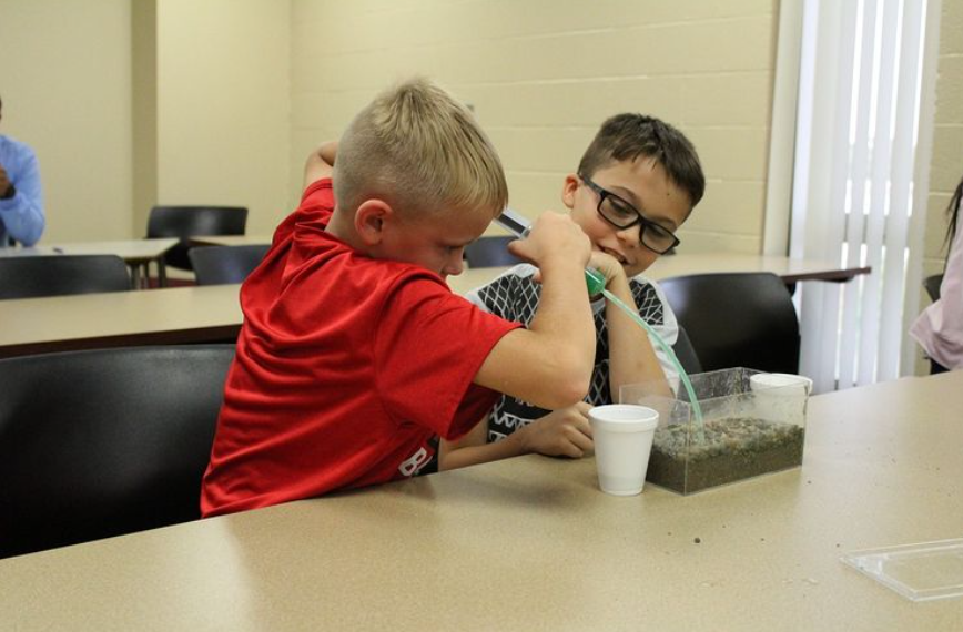 Two boys playing with the Awesome Aquifer kit